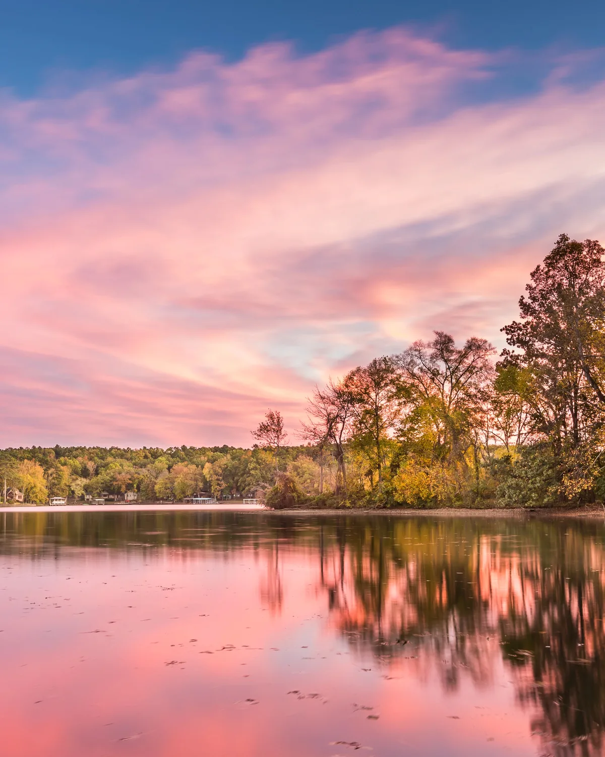 Sunset over Lake Hamilton with fall trees on the shore